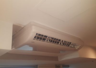 Artic Air specialise in under ceiling AC unit changeovers, like this 7.1 KW Fujitsu one done in Palais Apartments Adelaide