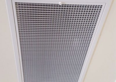 Ceiling metal Hinged powder coated return air grilles with washable filter installed for a Commercial Daikin unit installation in North Adelaide